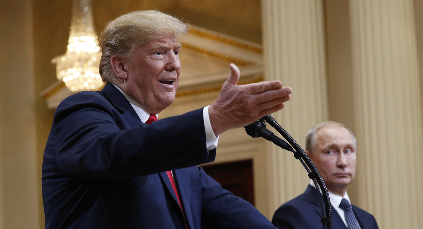 U.S. President Donald Trump, left, gestures while speaking beside Russian President Vladimir Putin, right.