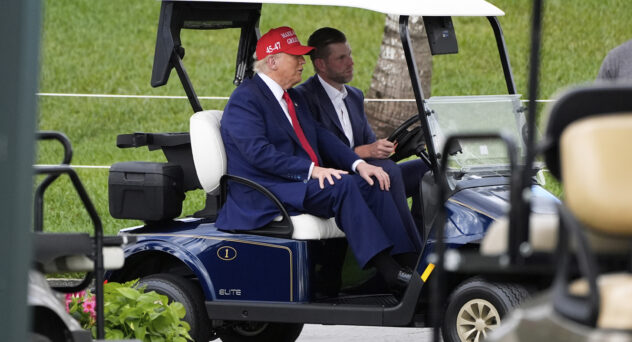 President Donald Trump, driven by his son Eric Trump, arrives at Trump National Doral during the LIV Golf Miami tournament, Thursday, April 3, 2025, in Miami.
