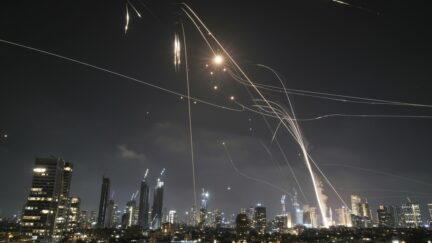 Israeli Iron Dome air defense system fires to intercept missiles over Tel Aviv, Israel, Friday, June 13, 2025.