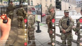DC protester playing Darth Vader theme at DC National Guard