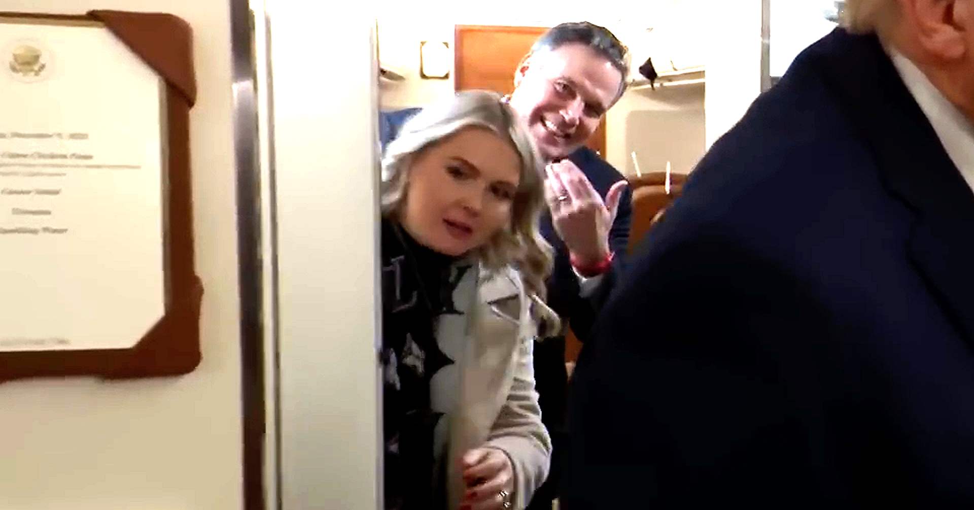 Trump was hit in the back with the bathroom door as someone tried to emerge during the gaggle — the culprit turned out to be White House press secretary Karoline Leavitt.