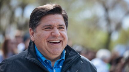 JB Pritzker laughing