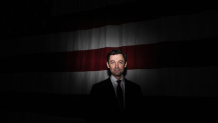 Sen. Jon Ossoff, D-Ga., in front of American flag