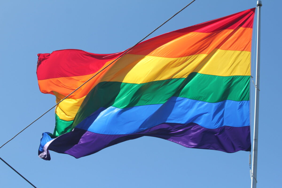 pride flag, rainbow flag with blue sky 