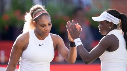 Serena Williams and Victoria Mboko compete during their round of 16 doubles match at The HSBC Championships 2026 women's tennis tournament at The Queen's Club in London, England, on June 9, 2026. (Photo by Owen Hammond/NurPhoto via AP)
