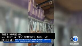 Video shows silver beams inside under construction building, buckled