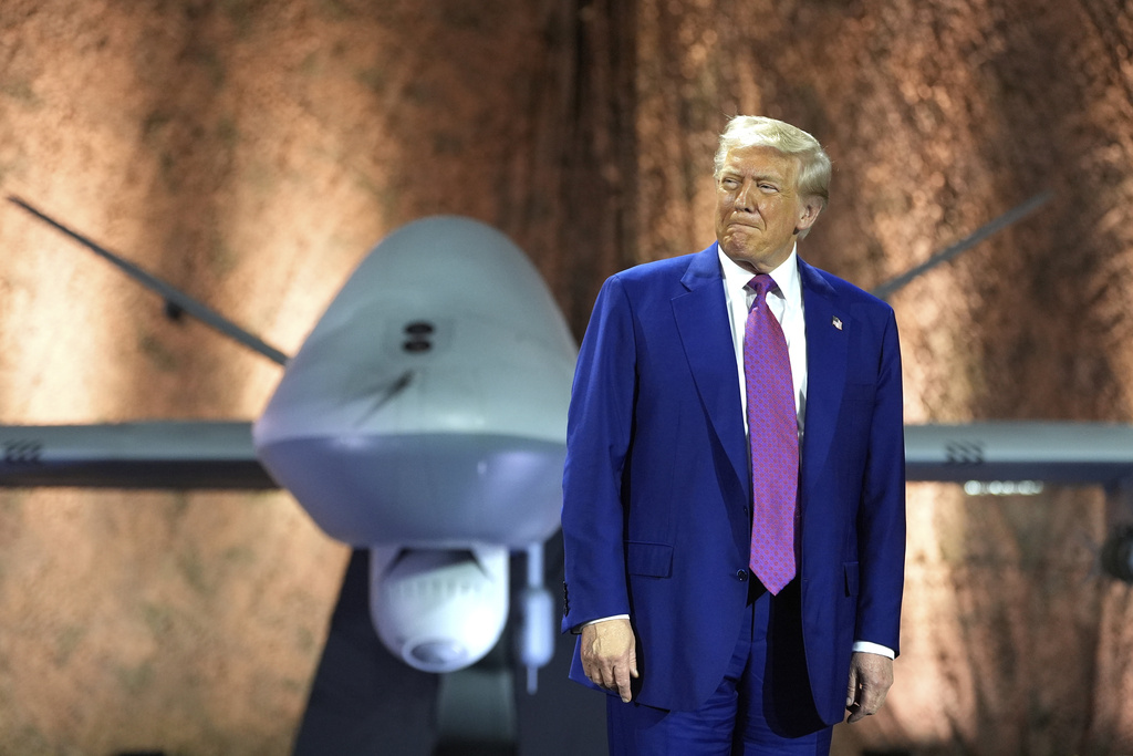 trump with an MQ-9 Reaper drone