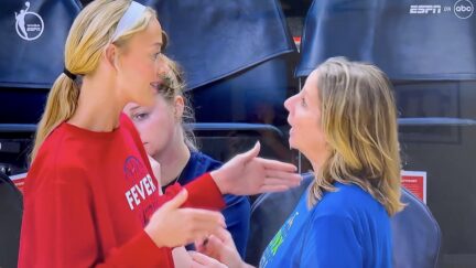 Sophie Cunningham talks to Minnesota Lynx head coach Cheryl Reeve before the game on Sunday.